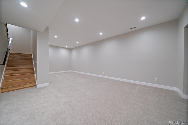 5838 S Louthan St, Littleton, CO 80120 - finished below grade area with light carpet, stairs, and recessed lighting