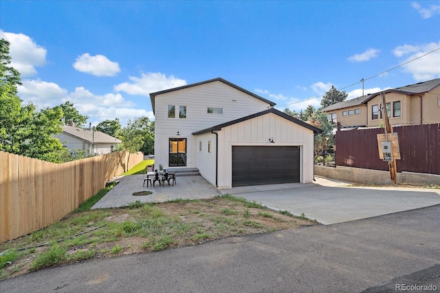 5838 S Louthan St, Littleton, CO 80120 - view of front facade with a garage and driveway