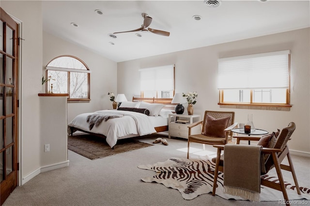 bedroom featuring vaulted ceiling, carpet, baseboards, and visible vents