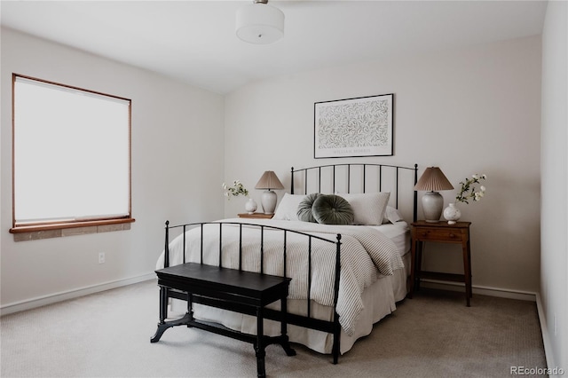 carpeted bedroom featuring baseboards