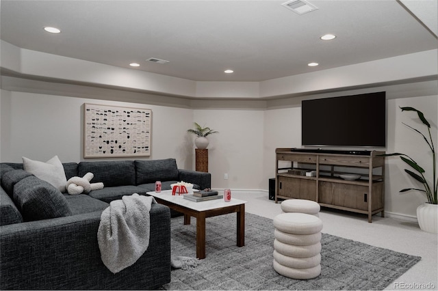 carpeted living area featuring visible vents, recessed lighting, and baseboards