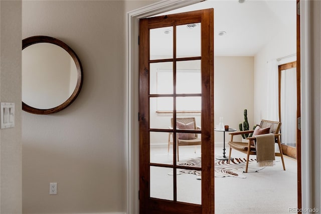 doorway with carpet flooring and french doors