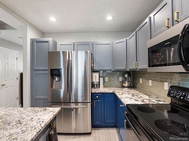 1747 N Pearl St Unit 306, Denver, CO 80203 - kitchen with stainless steel appliances, decorative backsplash, light stone countertops, blue cabinets, and recessed lighting