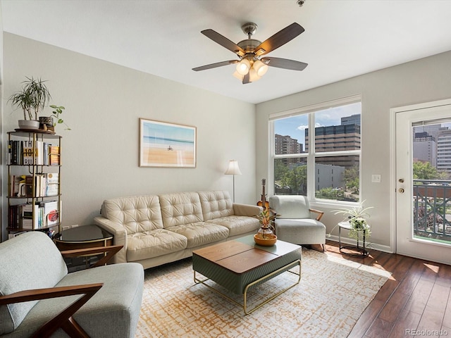 1747 N Pearl St Unit 306, Denver, CO 80203 - living area with dark wood-style floors, a ceiling fan, a view of city, and baseboards