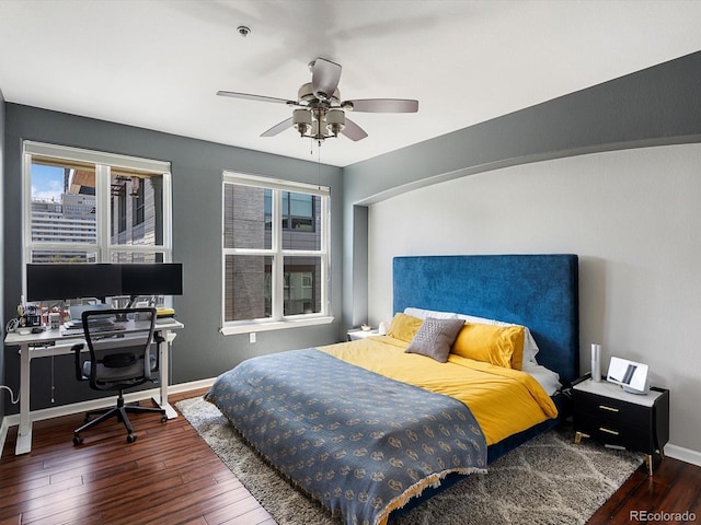 1747 N Pearl St Unit 306, Denver, CO 80203 - bedroom featuring wood finished floors, multiple windows, an office area, and baseboards