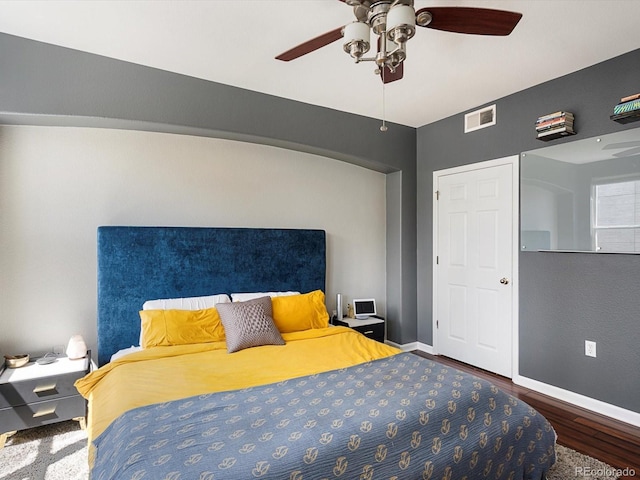 1747 N Pearl St Unit 306, Denver, CO 80203 - bedroom with wood finished floors, baseboards, and ceiling fan