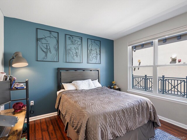 1747 N Pearl St Unit 306, Denver, CO 80203 - bedroom featuring baseboards and wood finished floors