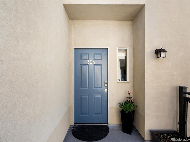 1747 N Pearl St Unit 306, Denver, CO 80203 - view of exterior entry with stucco siding