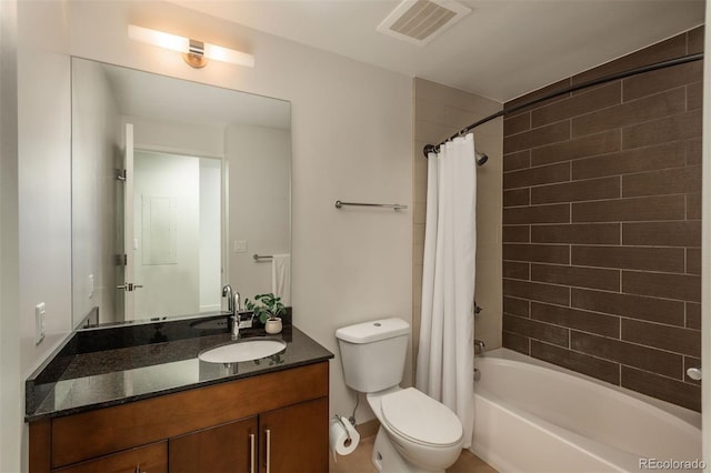 full bathroom with vanity, shower / bathtub combination with curtain, and toilet