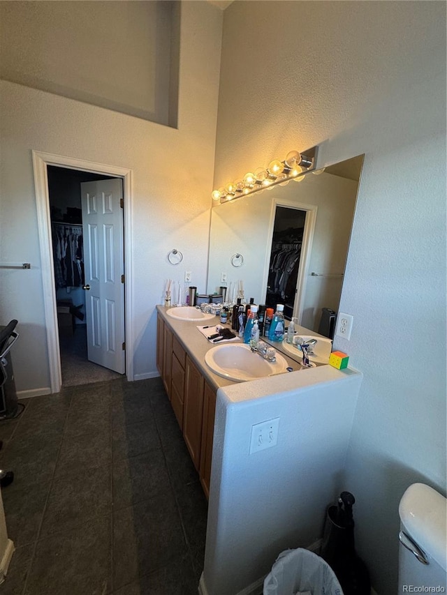 bathroom with tile patterned flooring and vanity