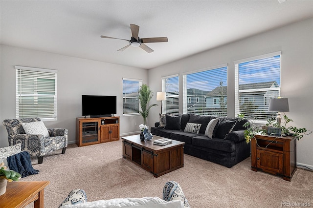 carpeted living room featuring ceiling fan