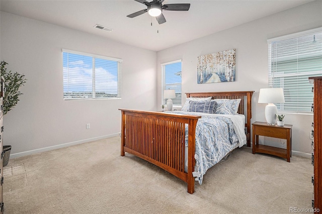 bedroom with light carpet and ceiling fan