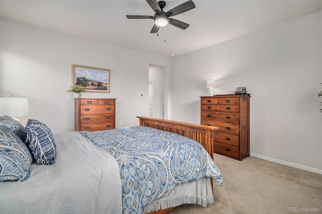 bedroom with light carpet and ceiling fan