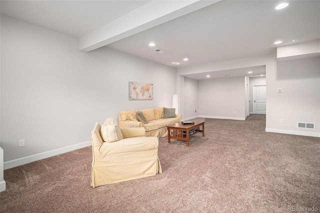 living room featuring beamed ceiling and carpet