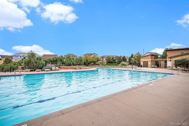 view of swimming pool featuring a patio