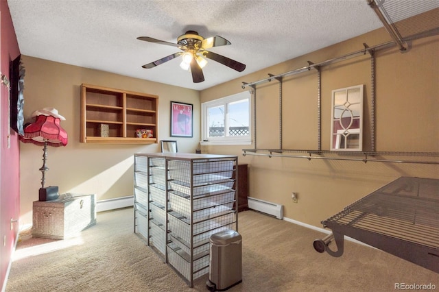 walk in closet featuring light carpet, ceiling fan, and a baseboard radiator