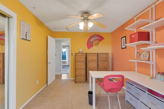 interior space featuring ceiling fan and a textured ceiling