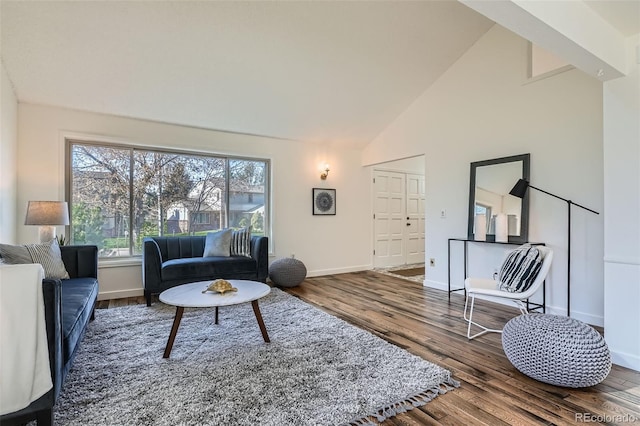 6487 W Weaver Ave, Littleton, CO 80123 - living area with wood finished floors, baseboards, and high vaulted ceiling