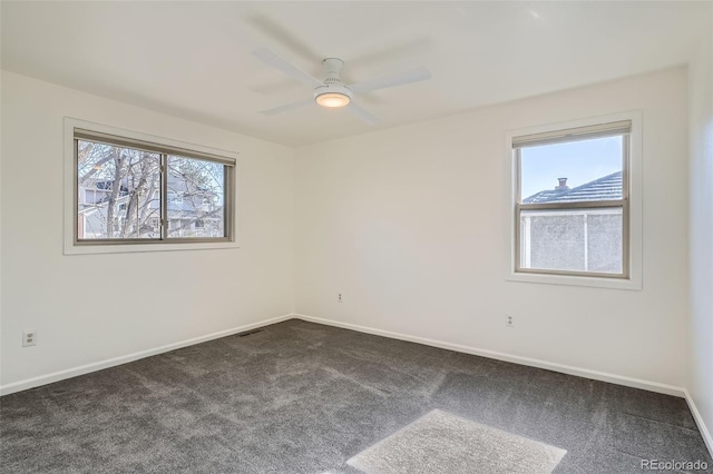 6487 W Weaver Ave, Littleton, CO 80123 - empty room with dark carpet, ceiling fan, and baseboards