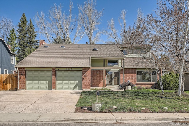 6487 W Weaver Ave, Littleton, CO 80123 - view of front of property featuring an attached garage, concrete driveway, brick siding, and a tile roof