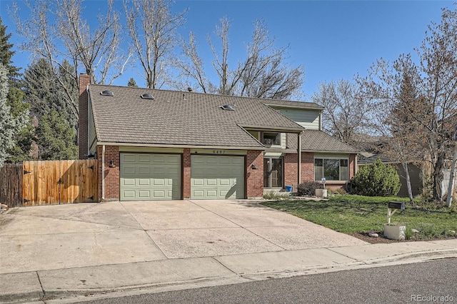 6487 W Weaver Ave, Littleton, CO 80123 - traditional-style house featuring an attached garage, brick siding, driveway, and a chimney