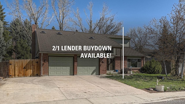 6487 W Weaver Ave, Littleton, CO 80123 - view of front facade with brick siding, driveway, a chimney, and a garage