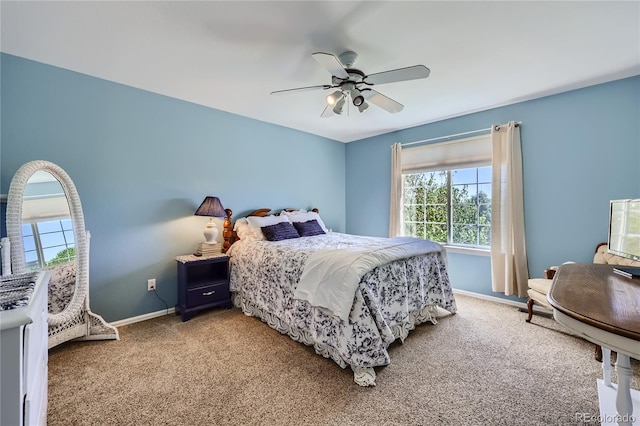 bedroom featuring ceiling fan, carpet flooring, and baseboards