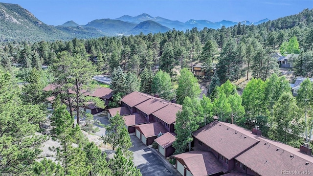 620 Macgregor Ave Unit 11, Estes Park, CO 80517 - aerial view of property's location featuring a forest and a mountainous background