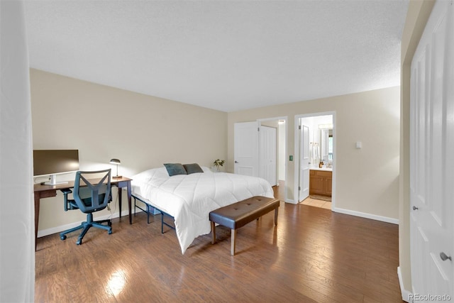 620 Macgregor Ave Unit 11, Estes Park, CO 80517 - bedroom featuring wood finished floors and ensuite bathroom