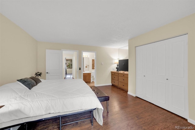 620 Macgregor Ave Unit 11, Estes Park, CO 80517 - bedroom with wood finished floors, a closet, and connected bathroom