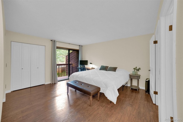 620 Macgregor Ave Unit 11, Estes Park, CO 80517 - bedroom with dark wood-type flooring and access to exterior