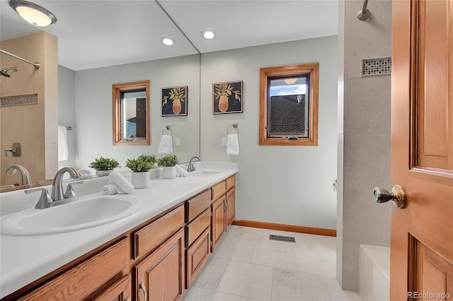 bathroom with tile patterned flooring and vanity