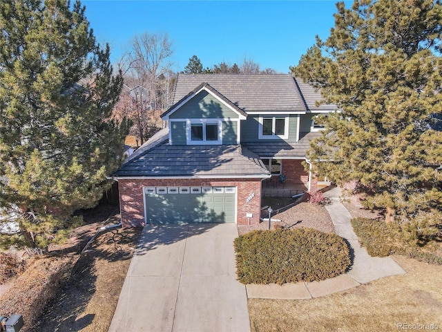 view of front property featuring a porch and a garage