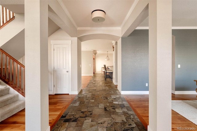 hall with hardwood / wood-style floors and crown molding