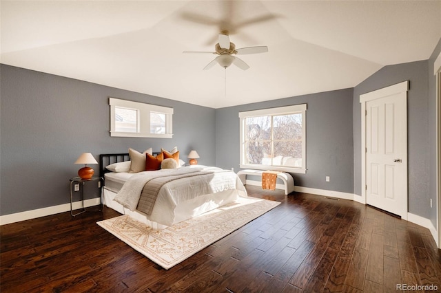 bedroom featuring ceiling fan, dark wood-type flooring, and lofted ceiling