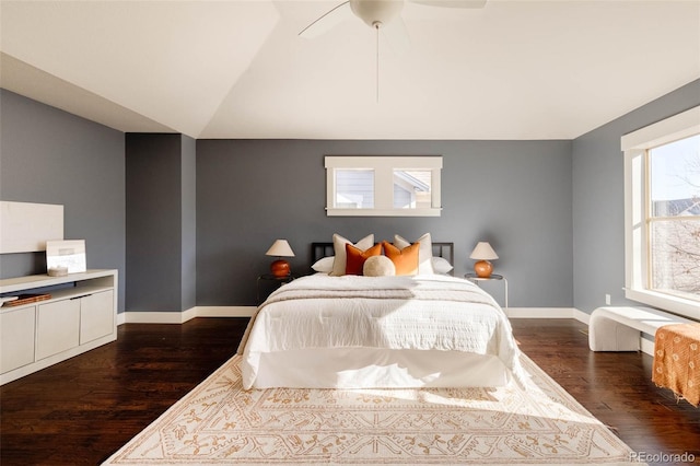 bedroom featuring ceiling fan, vaulted ceiling, and dark hardwood / wood-style floors