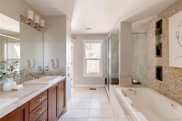 bathroom with tile patterned flooring, plus walk in shower, and vanity