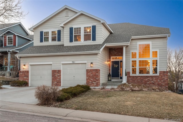 view of front of home with concrete driveway, brick siding, an attached garage, and a shingled roof