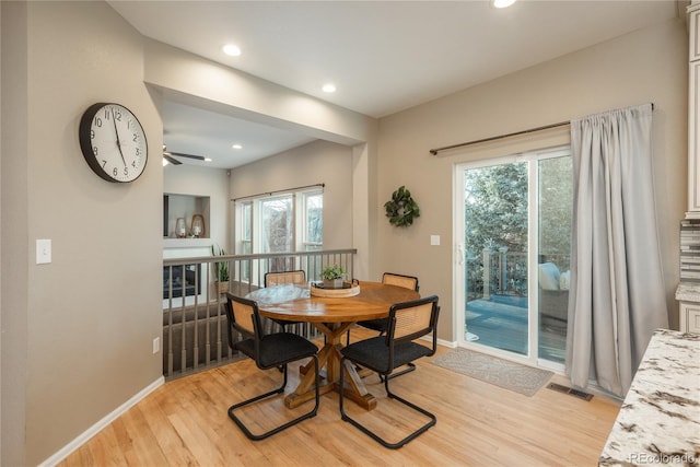 dining room featuring light wood finished floors, recessed lighting, visible vents, and baseboards