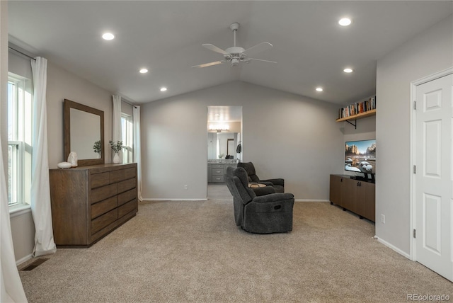 sitting room with vaulted ceiling, carpet, baseboards, and recessed lighting