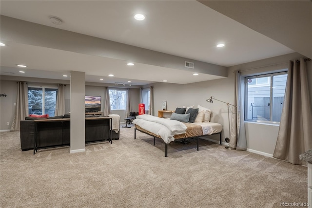 bedroom featuring recessed lighting, visible vents, and light colored carpet