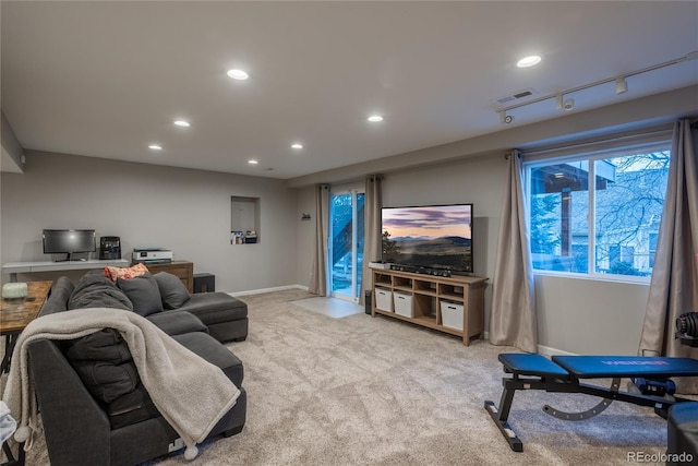 living room with light carpet, visible vents, baseboards, and recessed lighting