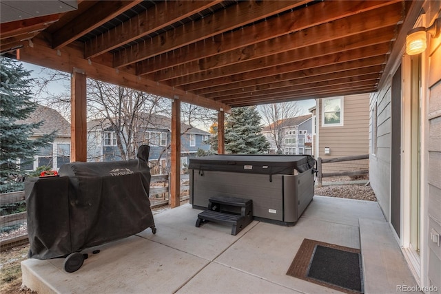 view of patio with grilling area and a hot tub