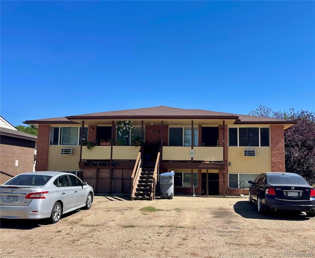 832 S Bowen St, Longmont, CO 80501 - view of front of house with stairway and brick siding