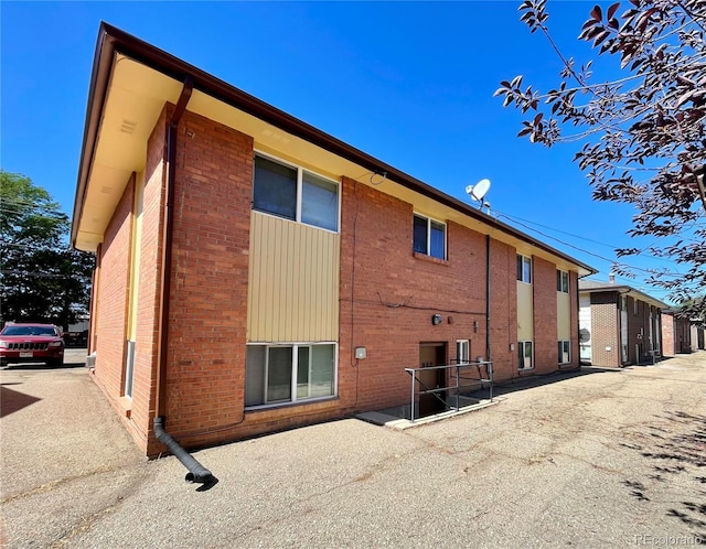832 S Bowen St, Longmont, CO 80501 - rear view of property featuring brick siding