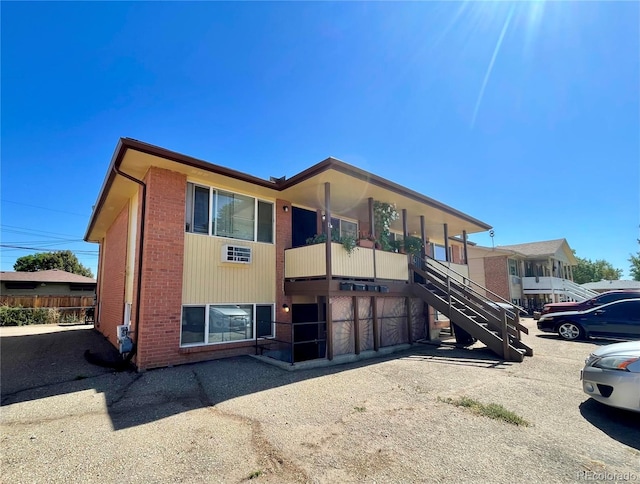 832 S Bowen St, Longmont, CO 80501 - view of front of house featuring stairs and brick siding