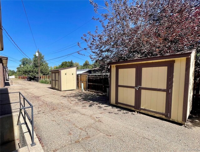 832 S Bowen St, Longmont, CO 80501 - view of shed featuring fence