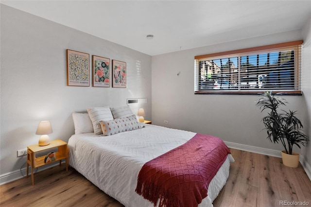 bedroom featuring hardwood / wood-style flooring