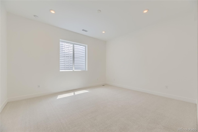 spare room with light carpet