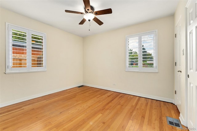 spare room featuring light hardwood / wood-style floors and ceiling fan